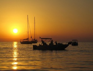 Enjoy sunset on a crewed yacht charter