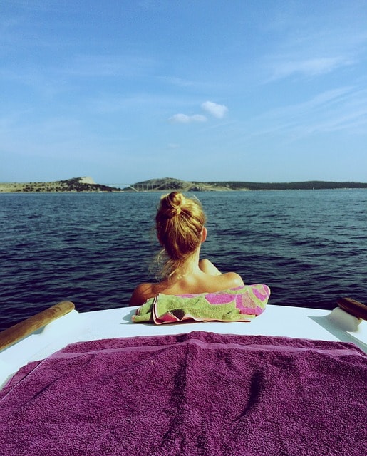 Women soak up the sun on a boat