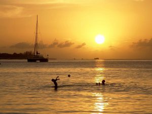 Children playing in the Caribbean sea