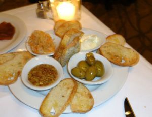 Bread and olives on a table