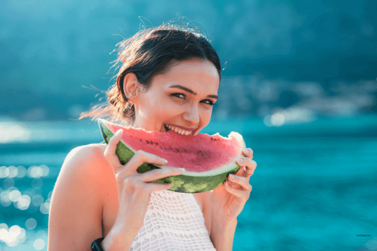 Eat watermelon  to stay cool on a boat