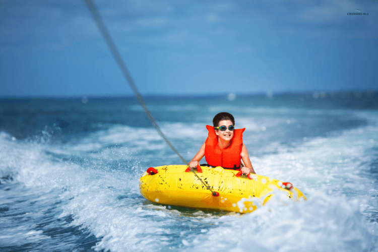 Ride on a tube to stay cool on a boat